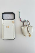 Funda Hermès y mini bolso extraíble.